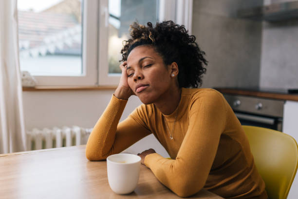 istock sleepy woman at home 1647803656
