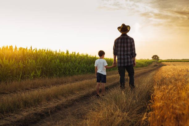 istock father and son outdoor in field 1647804376