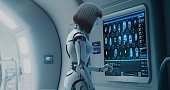 The cyborg girl conducts a scan on another robot.