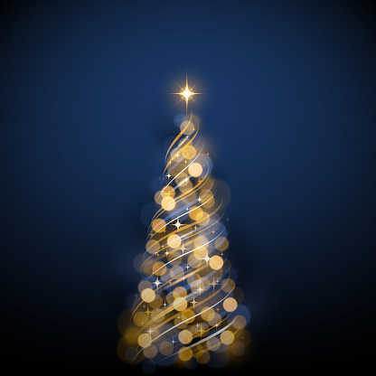 Out of focus blurred Christmas tree fairy lights on dark blue background.