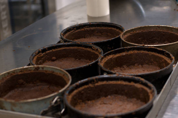 istock pastry chef preparing and baking stack of chocolate crust for salty caramel cheesecake 1647851000
