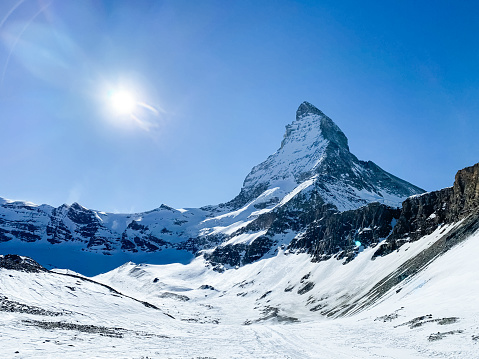 World famous mountain peak Matterhorn above Zermatt town in Mattertal, Valais canton, Switzerland, in winter.