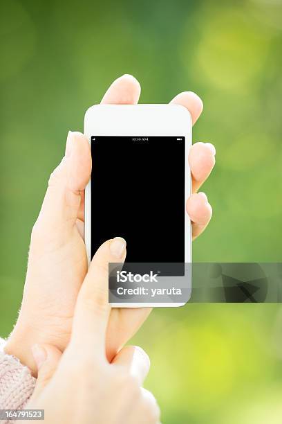 Woman Holding Smartphone Stock Photo - Download Image Now - Adult, Adults Only, Black Color
