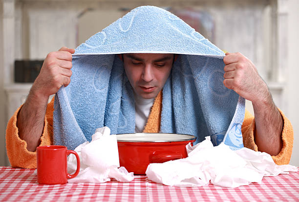 istock Man inhaling warm steam 164791625