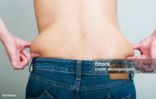 Woman Pinching Fat From Her Waist Stock Photo - Download Image Now - Anatomy, Over Eating, Abdomen