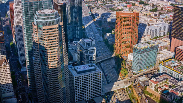 istock Traffic on highway amidst downtown city 1647949070
