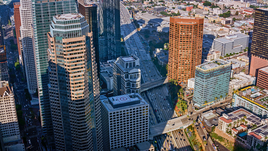 Aerial view of traffic driving on highway amidst downtown city in City Of Los Angeles, California, USA.