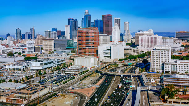 istock Traffic on highway amidst downtown city 1647949092