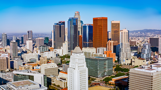 Aerial view of modern office buildings against blue sky in City Of Los Angeles, California, USA.