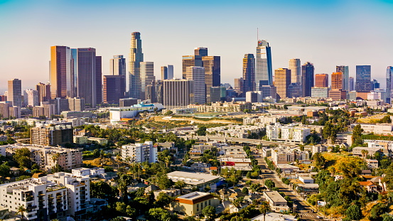 Aerial view of cityscape with residential buildings and modern office buildings against sky in City Of Los Angeles, California, USA.
