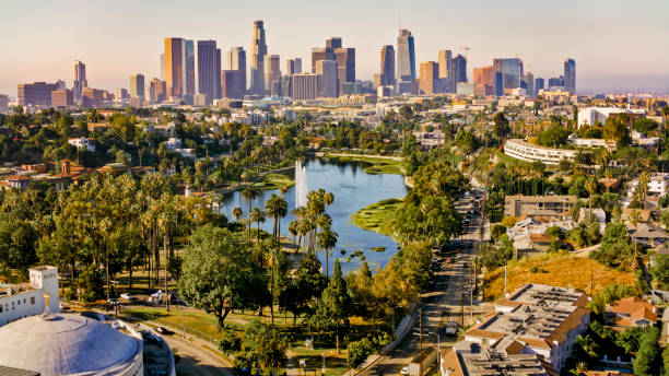 Echo Park Lake by neighbourhood Aerial view of Echo Park Lake surrounded by neighbourhood with high rise office buildings in background, City Of Los Angeles, California, USA. city street street man made structure place of work stock pictures, royalty-free photos & images