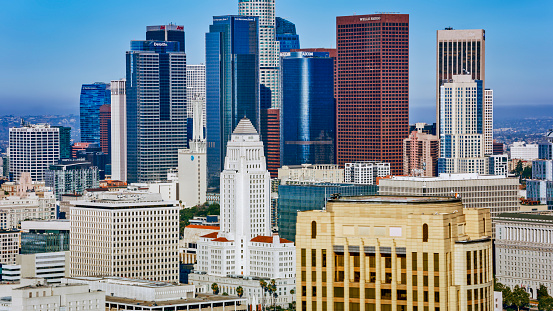 Aerial view of modern office buildings against blue sky in City Of Los Angeles, California, USA.