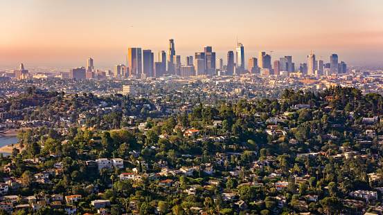 Aerial view of cityscape with residential district and high rise office buildings in background, City Of Los Angeles, California, USA.