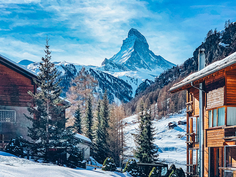 Snow covered mountain landscape in the French Savoie Alps region in the Val Thorens ski area resort during a beautiful clear winter day..