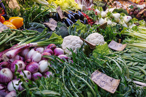 Traditional green market stall with fresh vegetables in Bologna, Italy