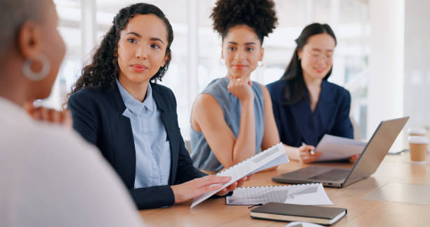 istock Teamwork, collaboration and business people with documents in meeting. Planning, laptop and group of women with computer and paperwork discussing sales, advertising or marketing strategy in office. 1647981879