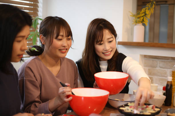 istock woman making takoyaki 1647984554