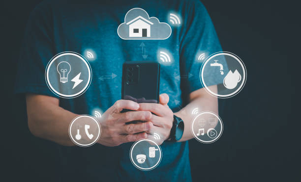 istock Man using a smartphone, controlling an intelligent home automation system Futuristic interface on a virtual screen Automation technology of things, concept Data connection with technology internet. 1648008504
