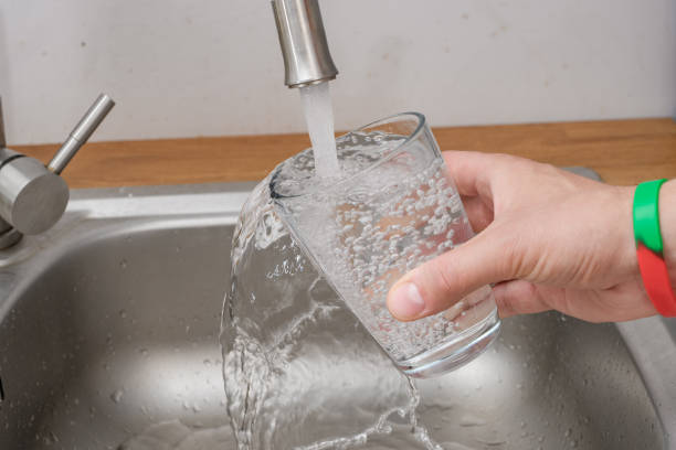 istock pour tap water into a glass, drink tap water 1648013484