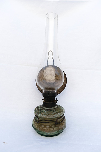 a paraffin lamp that was used in the countryside when there was no electricity