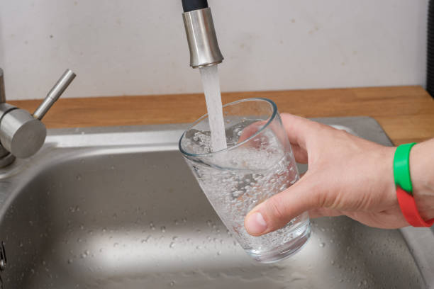 istock Tap water poured into a tap glass 1648015675