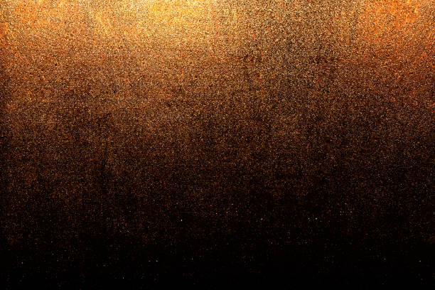 istock golden black glitter texture abstract banner background with space. Twinkling glow stars effect. Like outer space, night sky, universe. Rusty, rough surface, grain. 1648017799