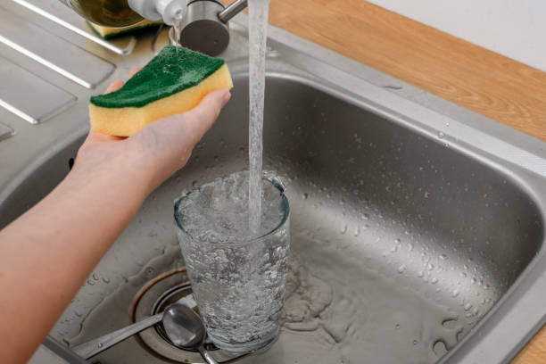 istock Dishwashing liquid dispensed onto a kitchen sponge 1648021696