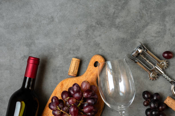 istock Glass of red wine and bottle and fresh crape 1648022020