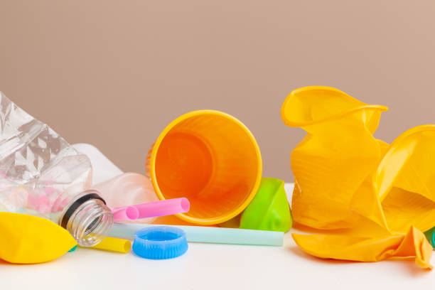 istock Plastic waste danger ecology concept with garbage and colorful single use straws, cutlery cups, bottles on white background 1648022295
