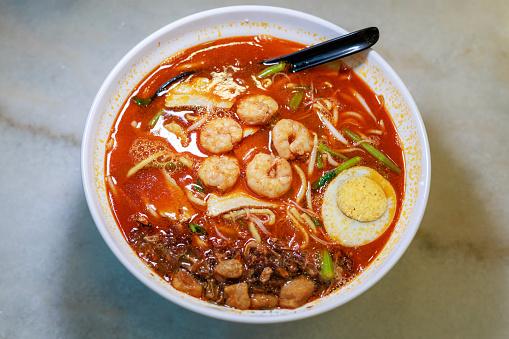 Penang's popular street food, Hokkien Mee, is known for its spicy prawn broth. It's a delicious and flavorful dish that's a must-try for anyone visiting Penang, Malaysia.