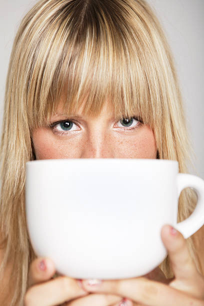 istock Woman holding coffee mug 164805889