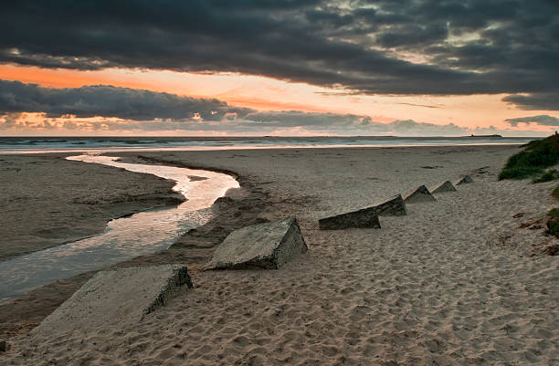 Bamburgh Beach at sunset stock photo