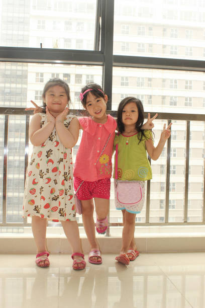 3 kids are very happy when meet together