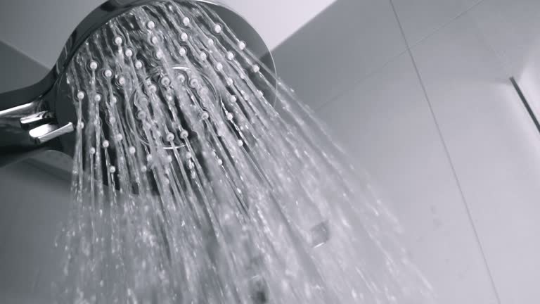 SLO MO LD Water running from the handheld shower head