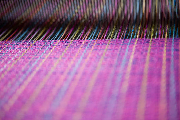 Weave Close up detail shot of weaving being done on a traditional Ecuadorian loom. loom stock pictures, royalty-free photos & images