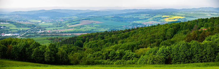 Panorama of hill, forest and field near village Lipa near Zlin in springtime. Czech republic.