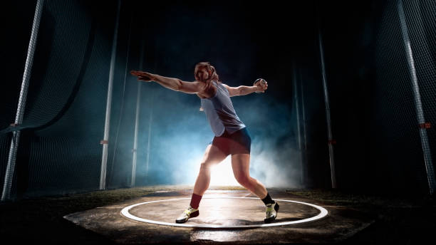 istock Female athlete turning with discus 1648117083