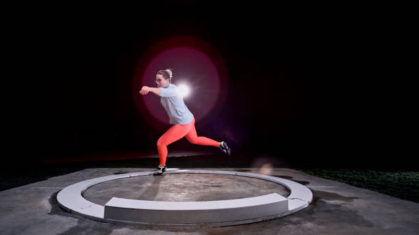 Female athlete holding shot put