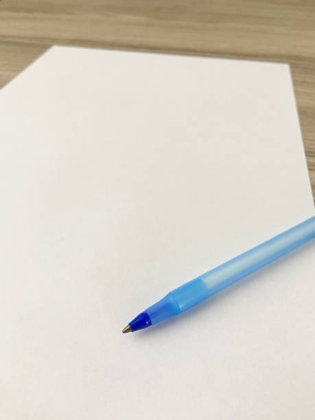 istock Ballpoint pen on a blank white paper 1648132503