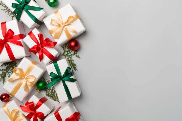 istock Gift boxes with decor on color background, top view 1648146118