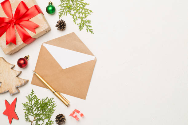 istock Craft envelope with christmas decoration on concrete background, top view 1648151748