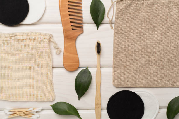 istock Flat lay with natural biodegradable accessories on wooden background, top view 1648152627