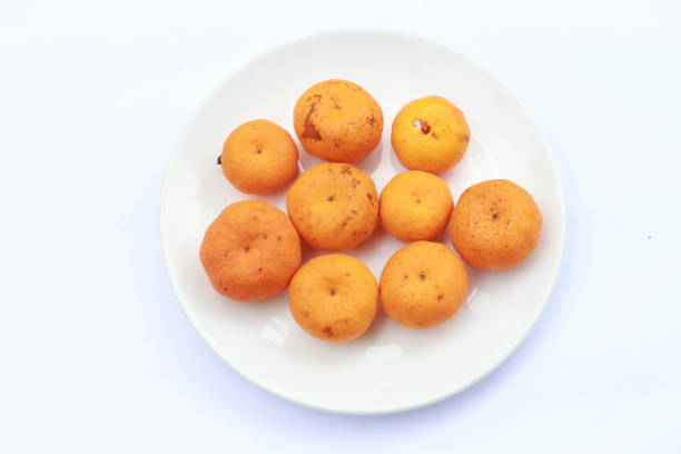 Fresh and ripe orange oranges fruits. Isolated on white background. Close up and copy space.
