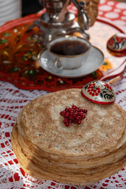 istock Russian pancake blini with berries and sour cream 1648165987