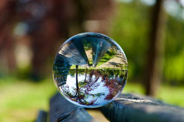 istock Crystal ball on wooden bench 1648166514