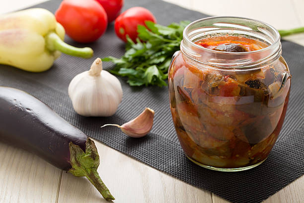 istock Cooked stewed eggplants prepared for canning with raw vegetables 164817330