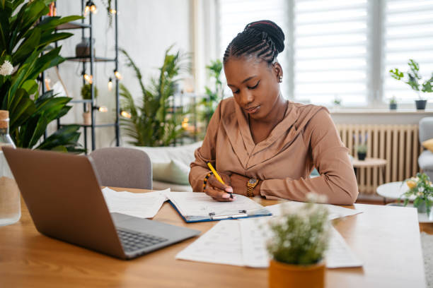 istock Young Woman Checking Her Finances On A Laptop At Home 1648179712