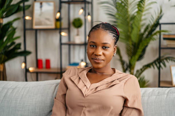 istock Young Woman Sitting On The Sofa At Home 1648180788