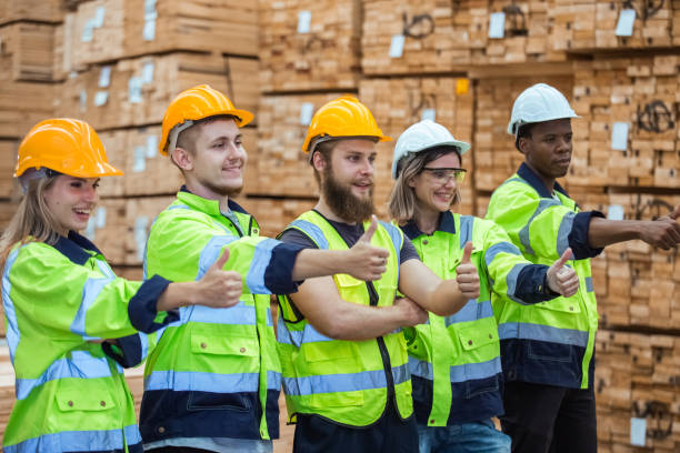 istock Team engineering worker technician, workshop manufacturing wooden, Teamwork in wood warehouse industry factory. Group professional technician industrial. 1648189175