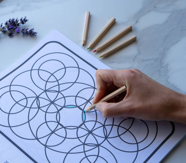 istock hand drawing an anti-stress coloring book 1648189318